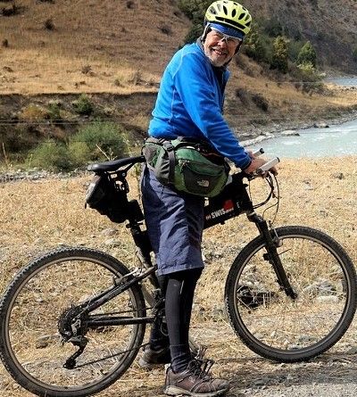Bob Harrison Cycling on the  tour with redspokes